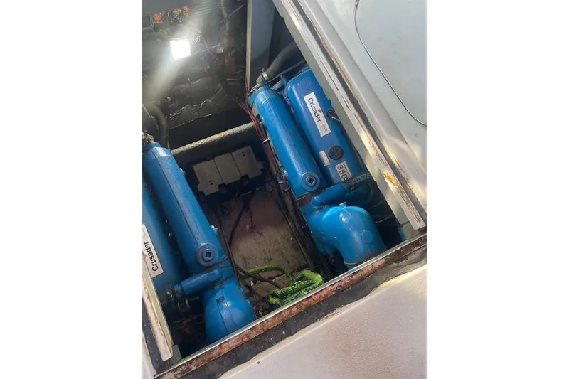 Slide: The Image of Engine compartment of 1987 Chris-Craft 332 Amerosport with blue Crusader engines. - 25