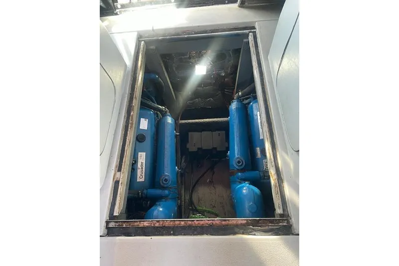 Slide: The Image of Engine compartment of 1987 Chris-Craft 332 Amerosport with Crusader engines visible. - 26