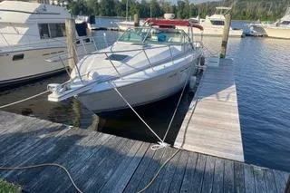 Slide: The Image of 1987 Chris-Craft 332 Amerosport docked at a marina with other boats. - 3
