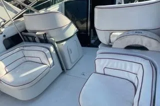 Slide: The Image of 1987 Chris-Craft 332 Amerosport boat interior with white cushioned seating. - 6