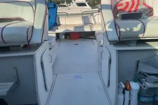 Slide: The Image of 1987 Chris-Craft 332 Amerosport boat interior with seating and deck view. - 7