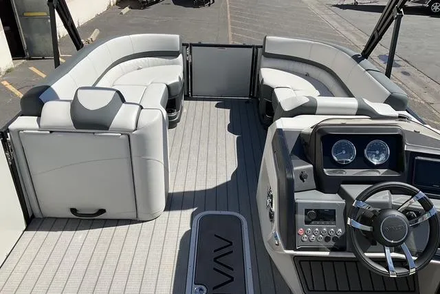 Slide: The Image of 2025 Avalon LSZ Quad Lounge Shift pontoon boat with modern seating and sleek dashboard design. - 11