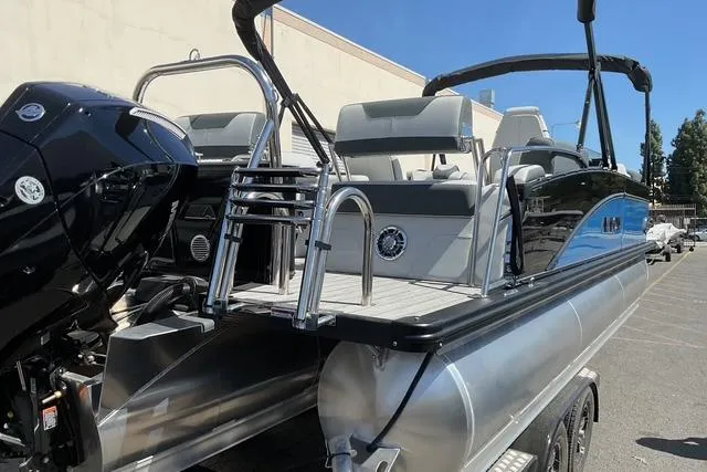 Slide: The Image of 2025 Avalon LSZ Quad Lounge Shift pontoon boat with sleek design and modern features. - 13