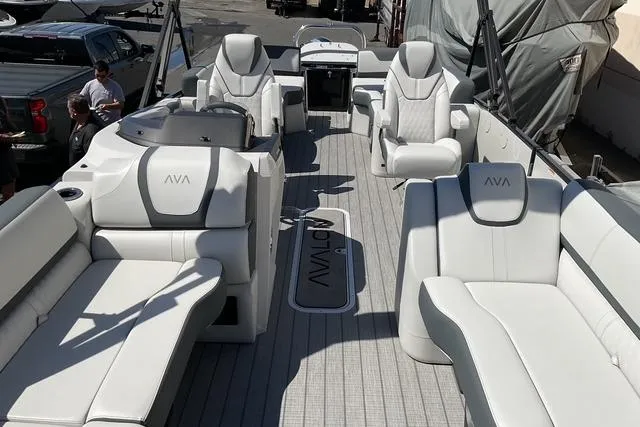 Slide: The Image of 2025 Avalon LSZ Quad Lounge Shift pontoon boat with luxurious seating and modern design. - 5