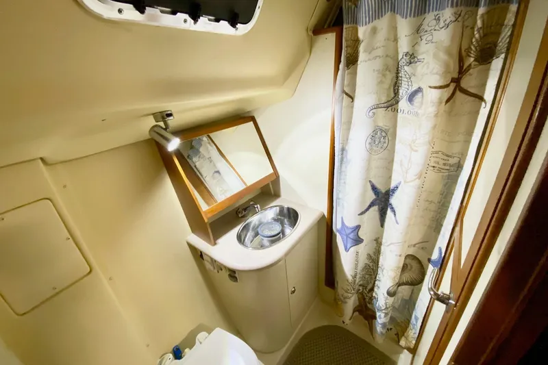 Slide: The Image of Bathroom interior of 2006 Hunter 41 Deck Salon with nautical-themed shower curtain. - 17