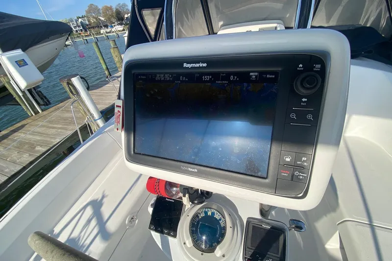 Slide: The Image of Raymarine navigation system on 2006 Hunter 41 Deck Salon sailboat, docked by the water. - 28