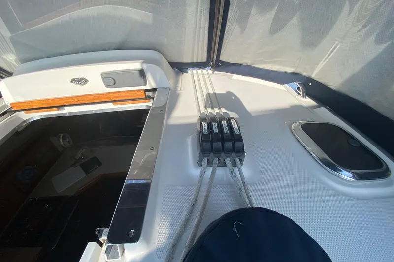 Slide: The Image of 2006 Hunter 41 Deck Salon yacht cockpit with control lines and hatch. - 30