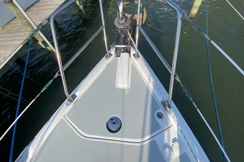 Slide: The Image of Bow view of 2006 Hunter 41 Deck Salon sailboat, featuring stainless steel railings. - 34