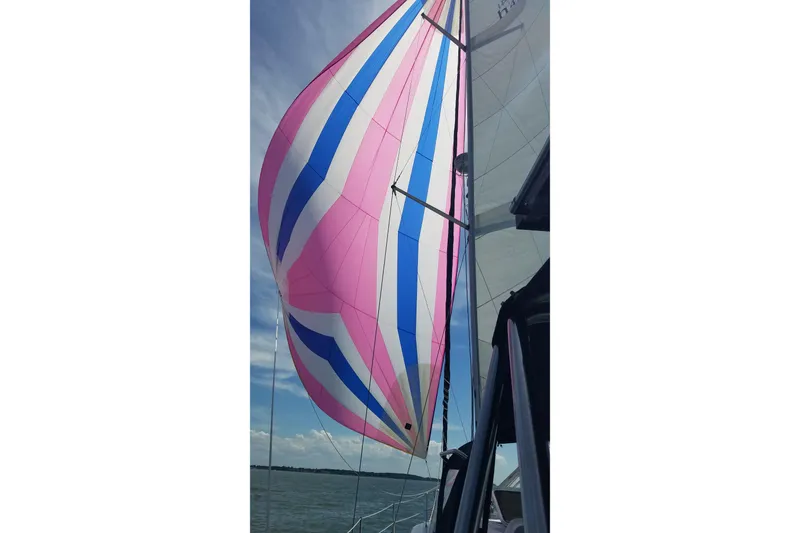 Slide: The Image of Colorful sails on a 2006 Hunter 41 Deck Salon yacht against a clear sky. - 4