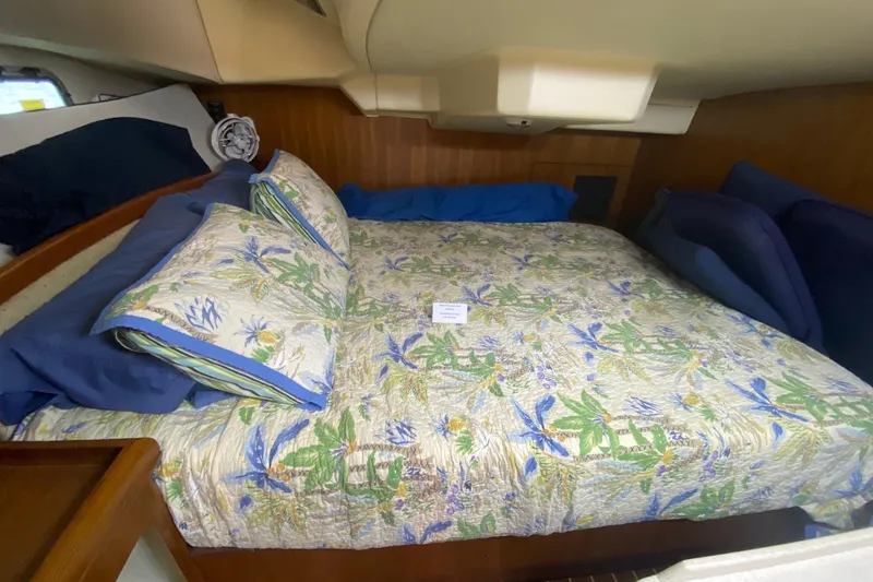 Slide: The Image of Cozy cabin interior of 2006 Hunter 41 Deck Salon with floral bedding. - 43