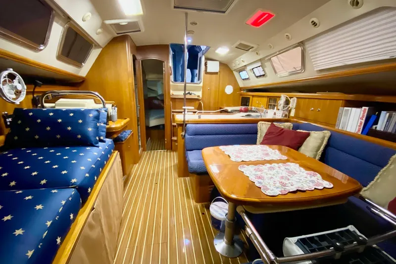 Slide: The Image of Luxurious interior of 2006 Hunter 41 Deck Salon yacht with elegant wood finish. - 6