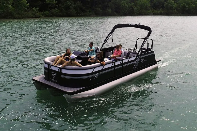 Slide: The Image of Manufacturer Provided Image: 2023 Viaggio Lago F pontoon boat cruising on a serene lake. - 8