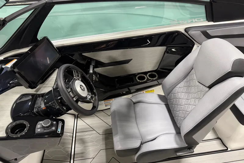Slide: The Image of 2026 Yamaha Boats 222XD cockpit with modern steering wheel and touchscreen display. - 3