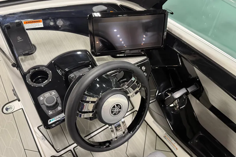 Slide: The Image of 2026 Yamaha Boats 222XD dashboard with steering wheel and touchscreen display. - 4