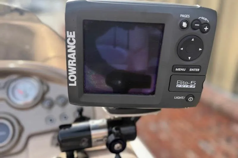 Slide: The Image of Lowrance Elite-5 CHIRP fishfinder on 2013 SunChaser PONTOON 22 dashboard. - 11