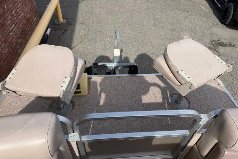 Slide: The Image of 2013 SunChaser PONTOON 22 boat with beige seats and metal railing. - 8
