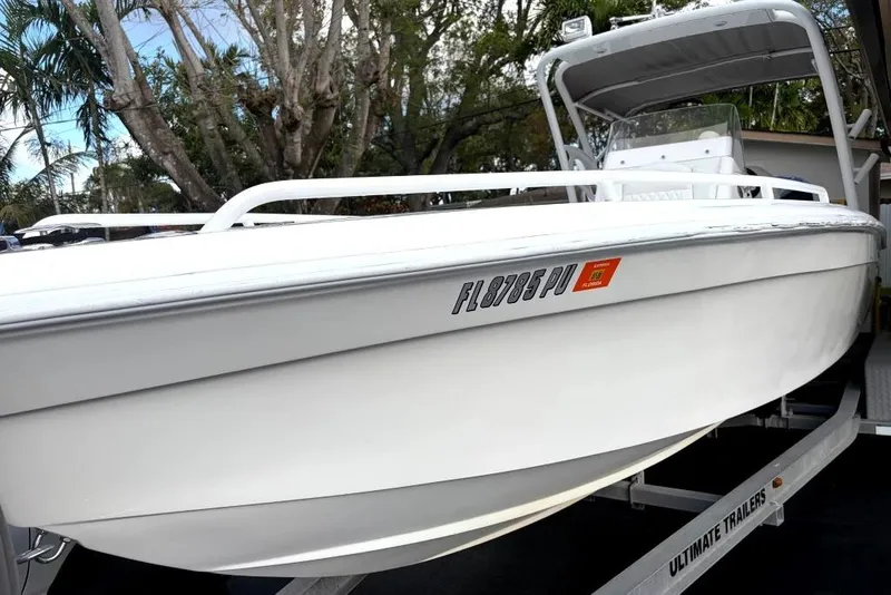 The Image of White 2015 Concept 27 boat on trailer in residential driveway. - 0