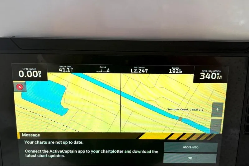 Slide: The Image of Covered 2015 Concept 27 boat on trailer, parked outdoors. - 10