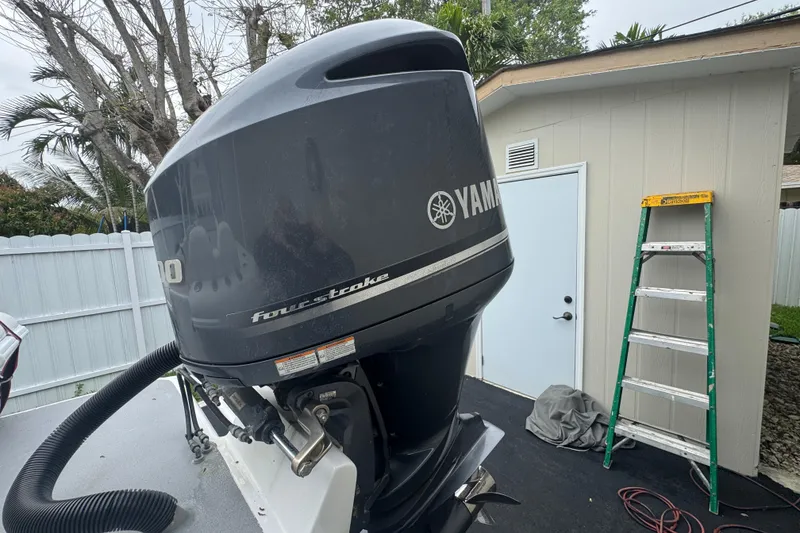 Slide: The Image of Control panel of a 2015 Concept 27 boat with ignition and searchlight switches. - 100