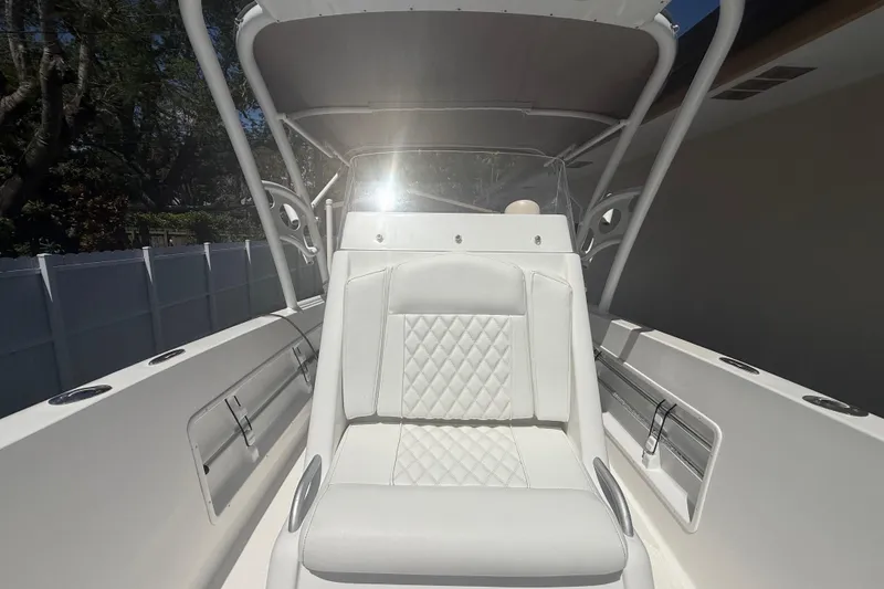 Slide: The Image of White Concept 27 boat interior with cushioned seating, 2015 model. - 105