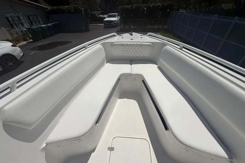 Slide: The Image of Spacious interior of a 2015 Concept 27 boat with white seating and sleek design. - 109