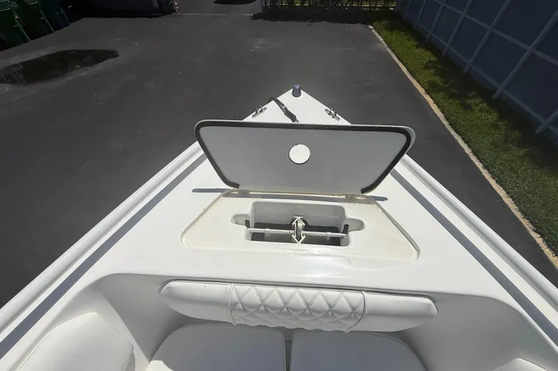 Slide: The Image of Bow of a 2015 Concept 27 boat with open anchor compartment. - 110