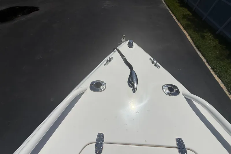 Slide: The Image of Bow of 2015 Concept 27 boat with cleats and fittings on a sunny day. - 111