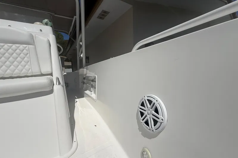 Slide: The Image of White Concept 27 boat interior with speaker, quilted seat, and railing, 2015 model. - 114