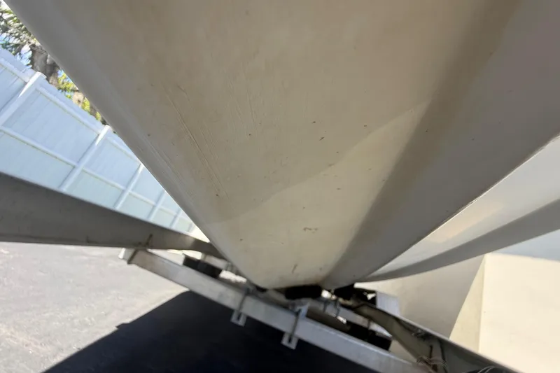 Slide: The Image of Underneath view of a 2015 Concept 27 boat hull on a trailer. - 126