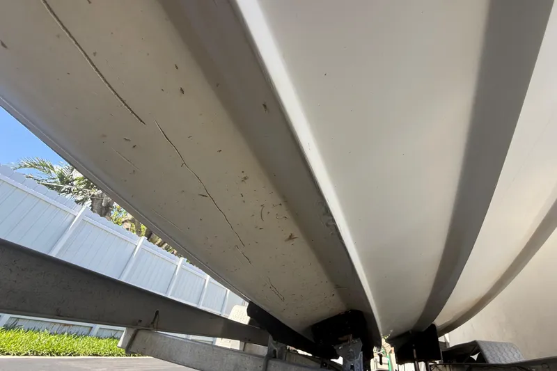Slide: The Image of Underside view of a 2015 Concept 27 boat on a trailer. - 127