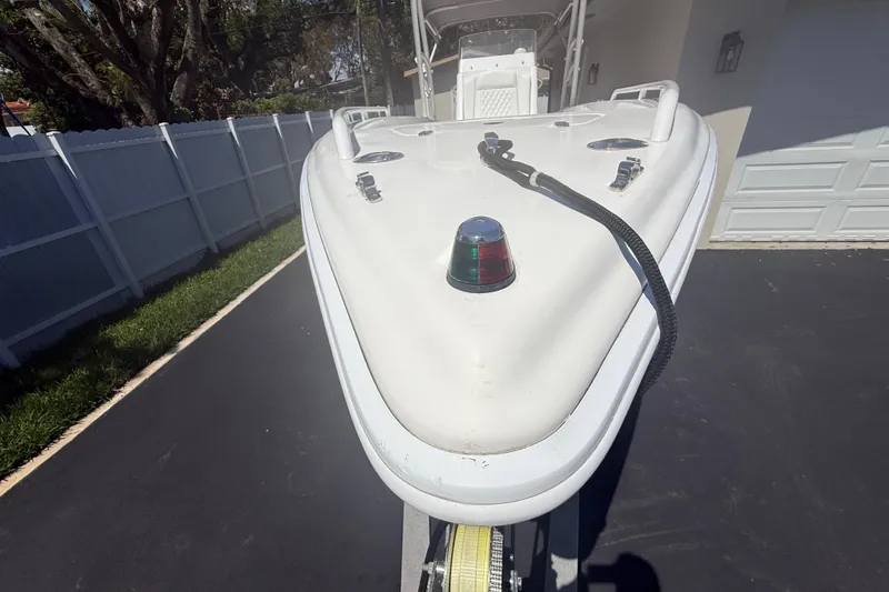 Slide: The Image of Bow of Concept 27 boat, 2015 model, parked on driveway with navigation light. - 134