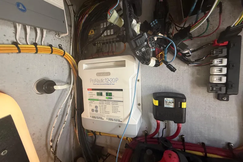 Slide: The Image of Electrical panel with ProNautic 12-20P charger and wiring, Concept 27, 2015 model. - 135