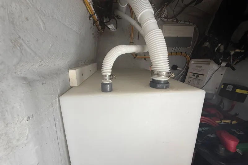 Slide: The Image of White tank with hoses in a Concept 27 model, 2015, utility room setup. - 138