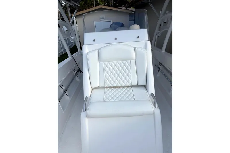 Slide: The Image of 2015 Concept 27 boat on trailer with Yamaha outboard motor in sunny setting. - 14