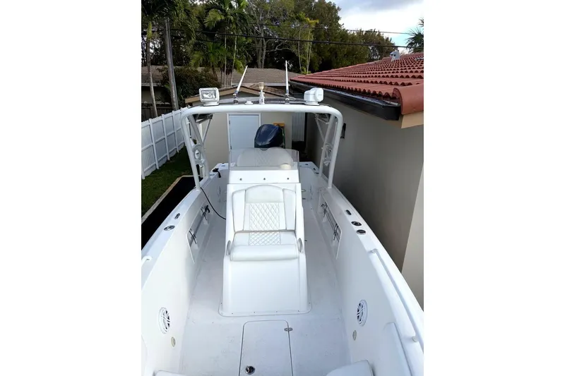 Slide: The Image of Luxurious white seating on Concept 27 boat, 2015 model, with quilted upholstery. - 19