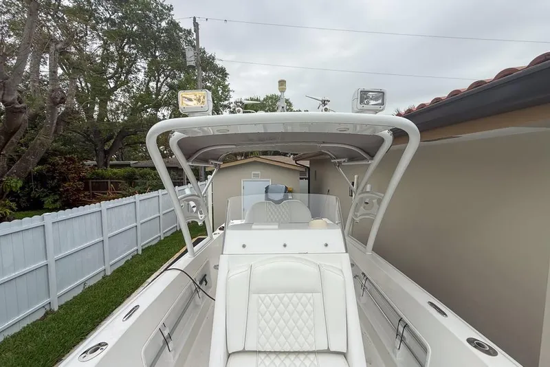 Slide: The Image of Boat labeled "Concept 27" from 2015, parked near a building with Yamaha engine. - 43