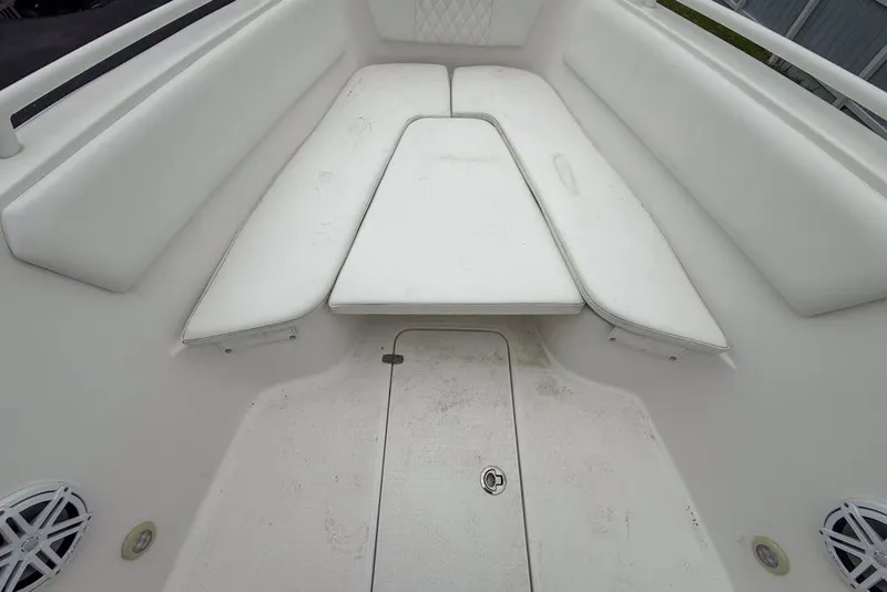Slide: The Image of White Concept 27 boat with Yamaha outboard motor, parked outdoors, 2015 model. - 45