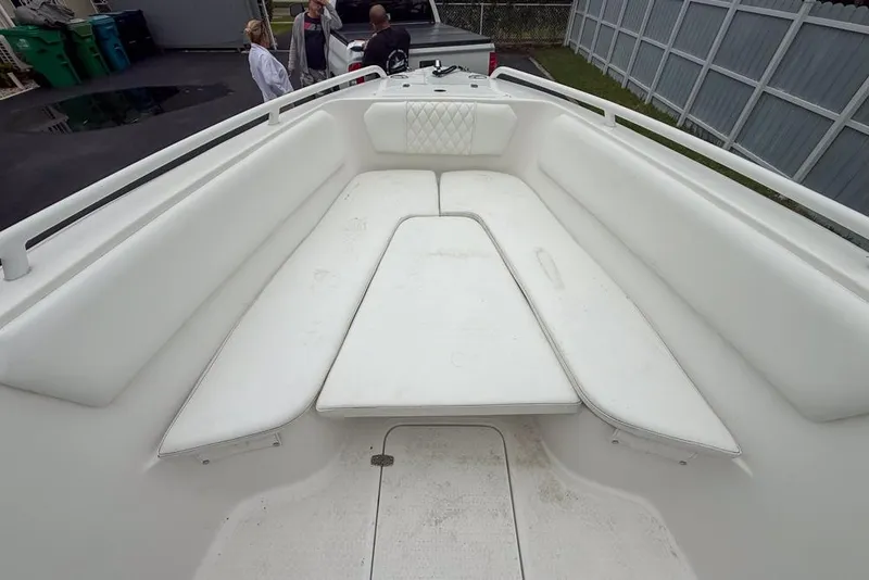 Slide: The Image of Rear view of a 2015 Concept 27 boat on a driveway. - 46