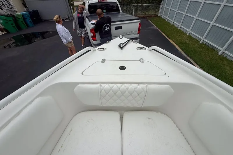 Slide: The Image of Outboard motor on a Concept 27 boat, parked in a driveway, 2015 model. - 47