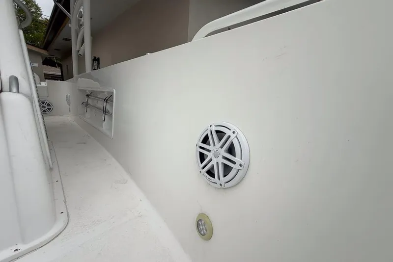 Slide: The Image of 2015 Concept 27 boat with Yamaha 300 V6 engine parked outdoors. - 48