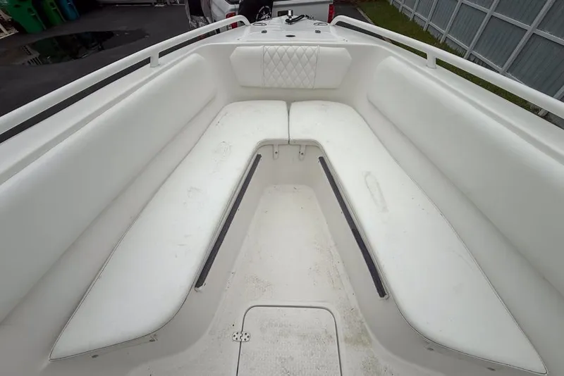 Slide: The Image of Rear view of Concept 27 boat, 2015 model, parked on driveway with sunlight. - 51