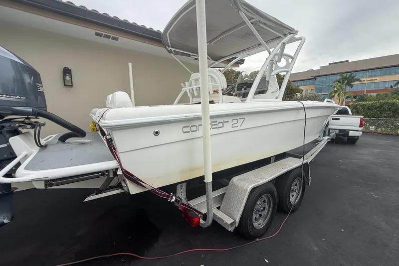 Slide: The Image of Boat engine close-up with Concept 27 model, 2015, showing mechanical components and hose. - 56