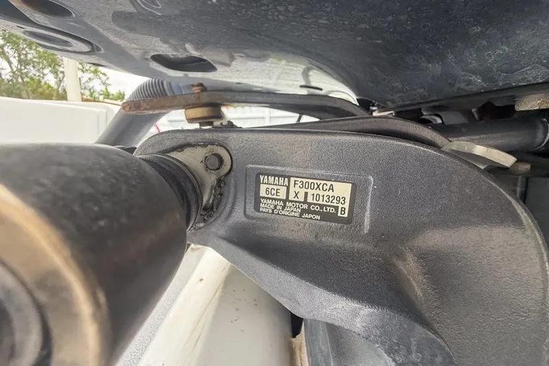 Slide: The Image of Underneath view of a 2015 Concept 27 boat on a trailer, near a white fence. - 61