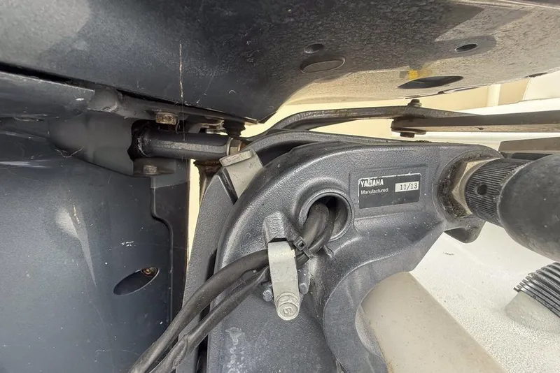 Slide: The Image of Trailer wheels of a 2015 Concept 27 boat on pavement. - 64