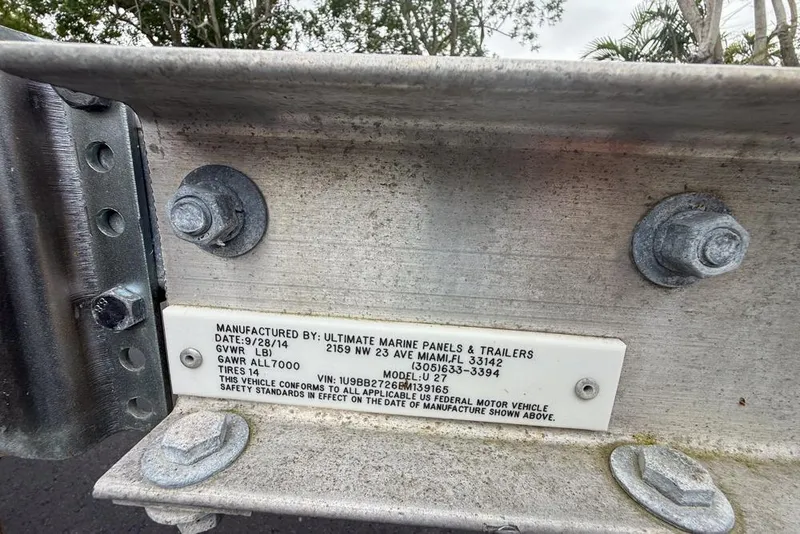 Slide: The Image of Close-up of a 2015 Concept 27 boat railing under a sunny sky. - 69