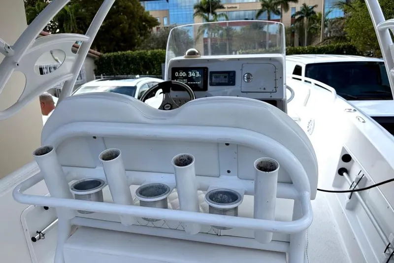 Slide: The Image of Covered 2015 Concept 27 boat on trailer in driveway, near house and car. - 7