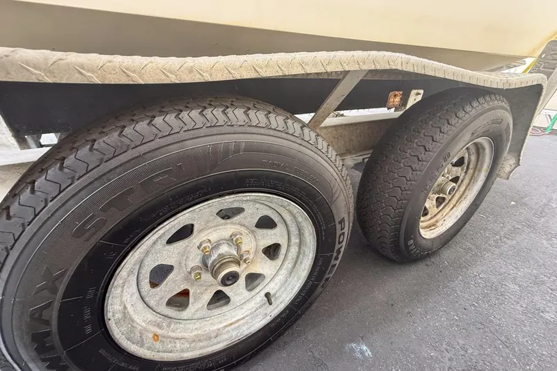 Slide: The Image of Boat with Yamaha 300 engine, Concept 27 model, 2015, featuring white seating and deck. - 71