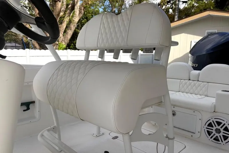 Slide: The Image of Covered Concept 27 boat on trailer, parked in driveway, 2015 model. - 8