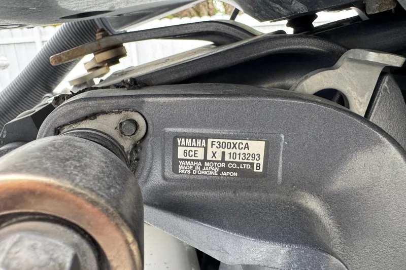 Slide: The Image of Cockpit view of 2015 Concept 27 boat with rod holders and clear sky background. - 82