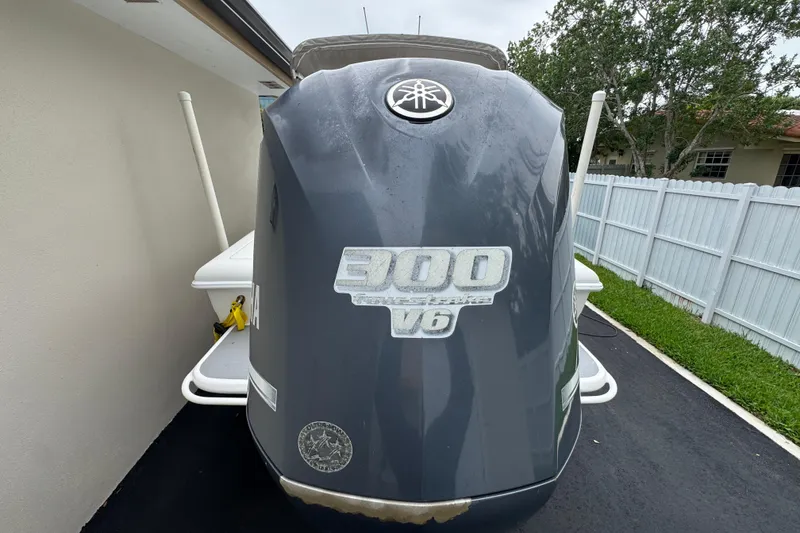 Slide: The Image of Steering console of a 2015 Concept 27 boat, featuring controls and a steering wheel. - 85